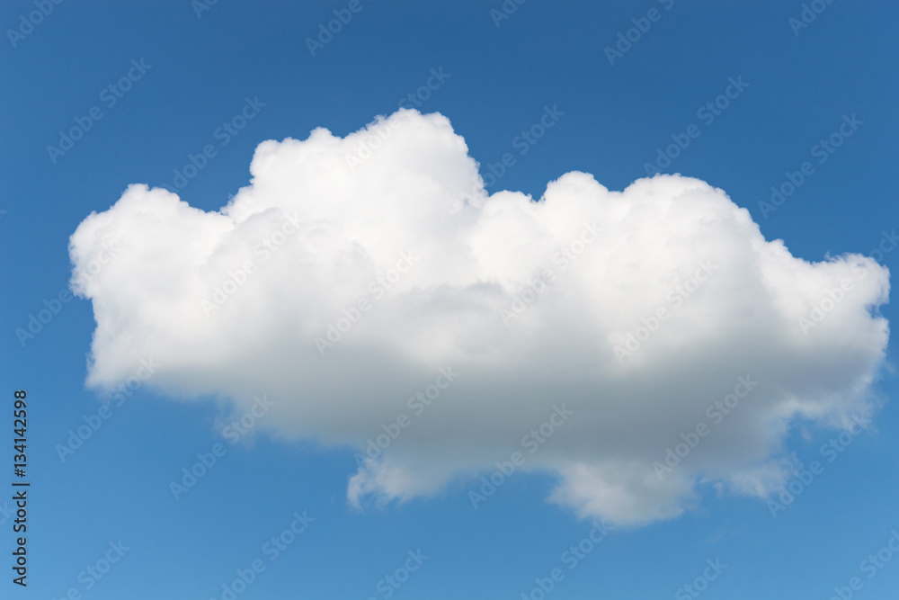 One single fluffy Cumulus cloud in clear deep blue summer sky One single fluffy Cumulus cloud in clear deep blue summer sky