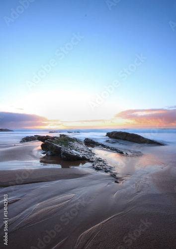 Amazing colours at the sunset in a beach, guincho beach cascais portugal. long exposure photo