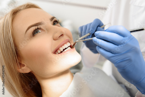 Dentist having view of client teeth