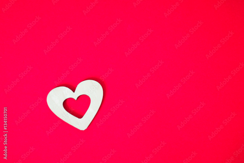 wooden heart on a pink background wooden heart on a pink background