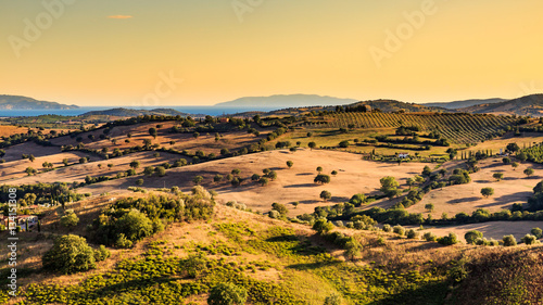 View of a tuscan fields and hills in Maremma region photo