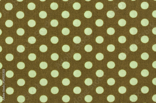 Beige with light green polka dots background pattern.
