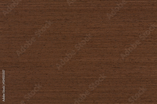 Surface of wenge wood background for design and decoration.