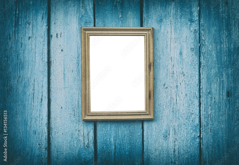 empty wooden frame hanging on blue cracked wooden wall empty wooden frame hanging on blue cracked wooden wall