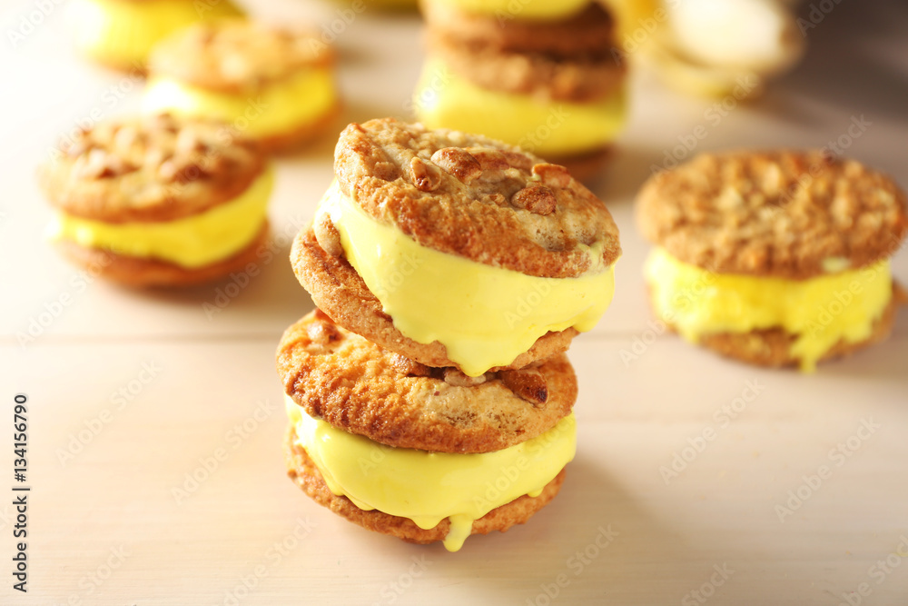 Delicious lemon ice cream cookie sandwiches on kitchen table, closeup Delicious lemon ice cream cookie sandwiches on kitchen table, closeup