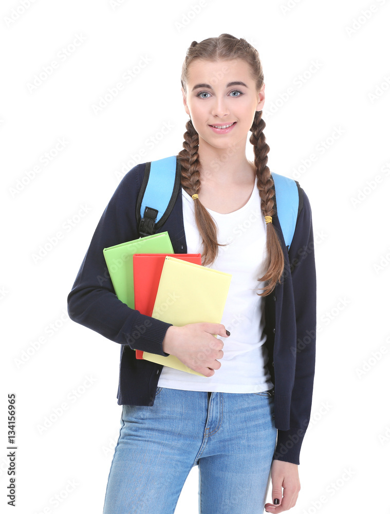 Pretty teenager girl with books on white background