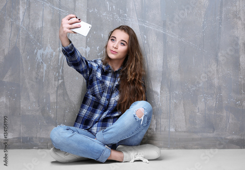 Pretty teenager girl taking...