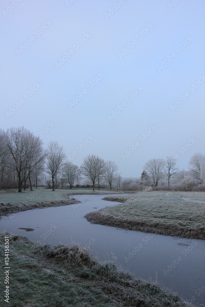 Frozen ditch in a winter scenery Frozen ditch in a winter scenery
