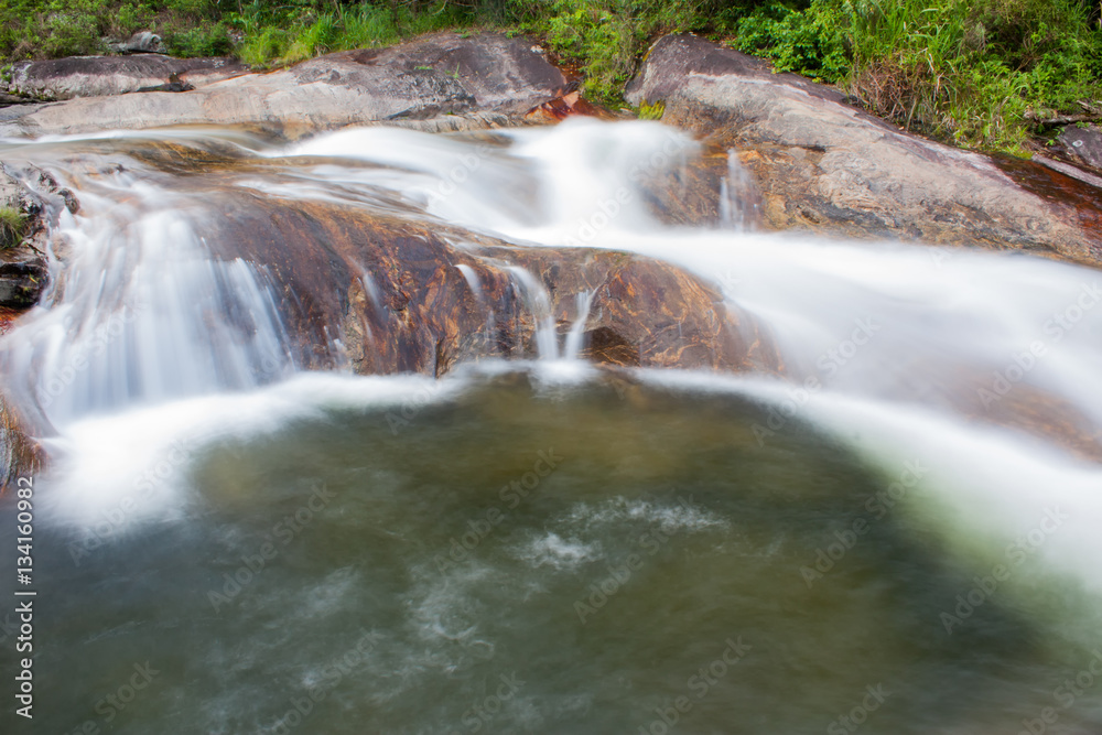 Fototapeta premium Waterfall with green water at the bottom