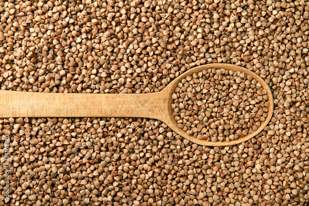 Buckwheat in a wooden spoon Buckwheat in a wooden spoon