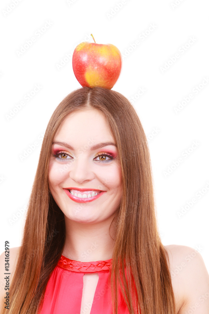 Beautiful woman holds apple fruit on head Beautiful woman holds apple fruit on head