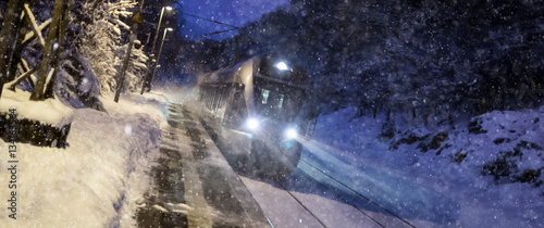 train speeding in a snowy winter night © Tobias Arhelger
