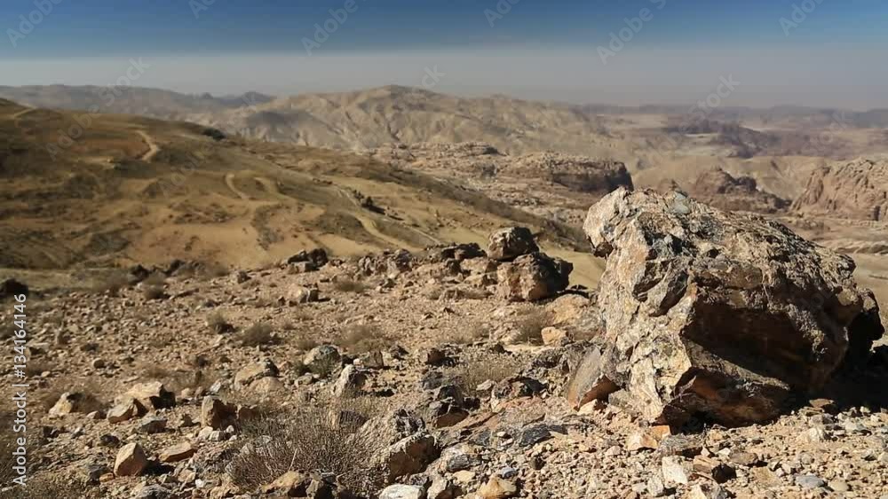 Beautiful view of Wadi Sabra desert in Hashemite Kingdom of Jordan. Amazing scenery of stony desert in Jordan, camera lens with polarisation filter Beautiful view of Wadi Sabra desert in Hashemite Kingdom of Jordan. Amazing scenery of stony desert in Jordan, camera lens with polarisation filter
