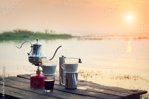 Coffee percolator on a campfire at morning close-up photo