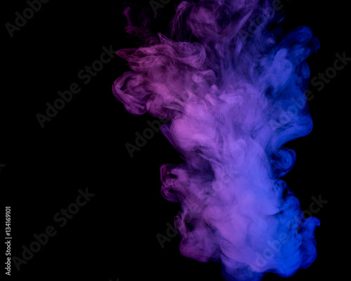 Abstract smoke Weipa. Personal vaporizers fragrant steam. The concept of alternative non-nicotine smoking. Blue lilac smoke on a black background. E-cigarette. Evaporator. Taking Close-up. Vaping.