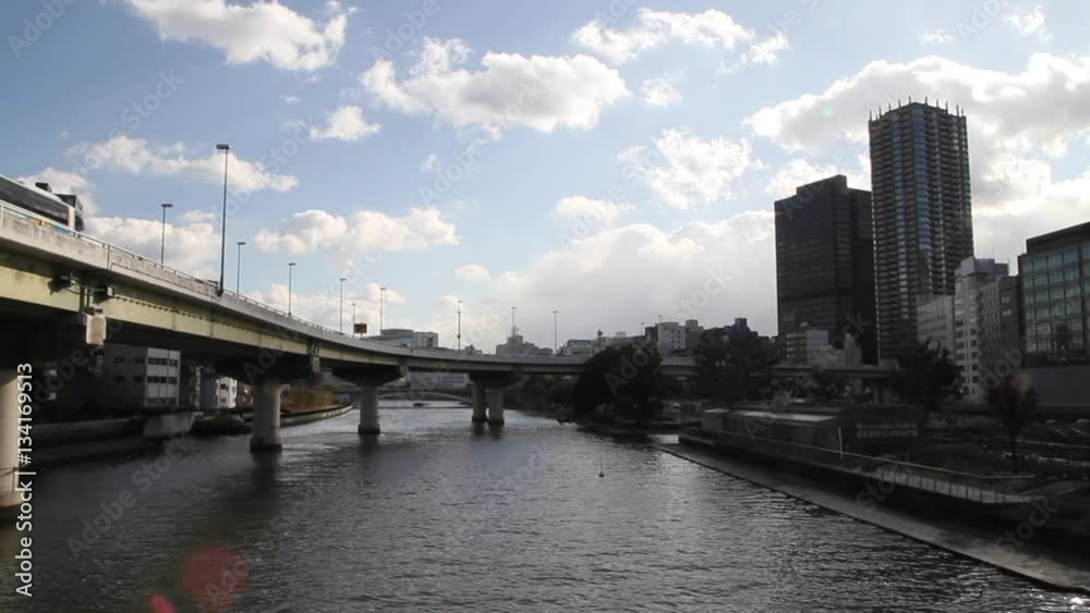 time lapse of big bridge in water with city overview at osaka as time-lapse time lapse of big bridge in water with city overview at osaka as time-lapse