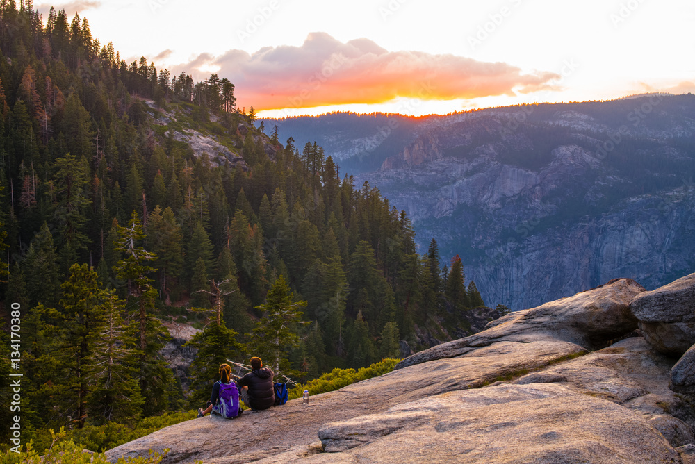Yosemite National Park - Two Hikers Watching the Sunset