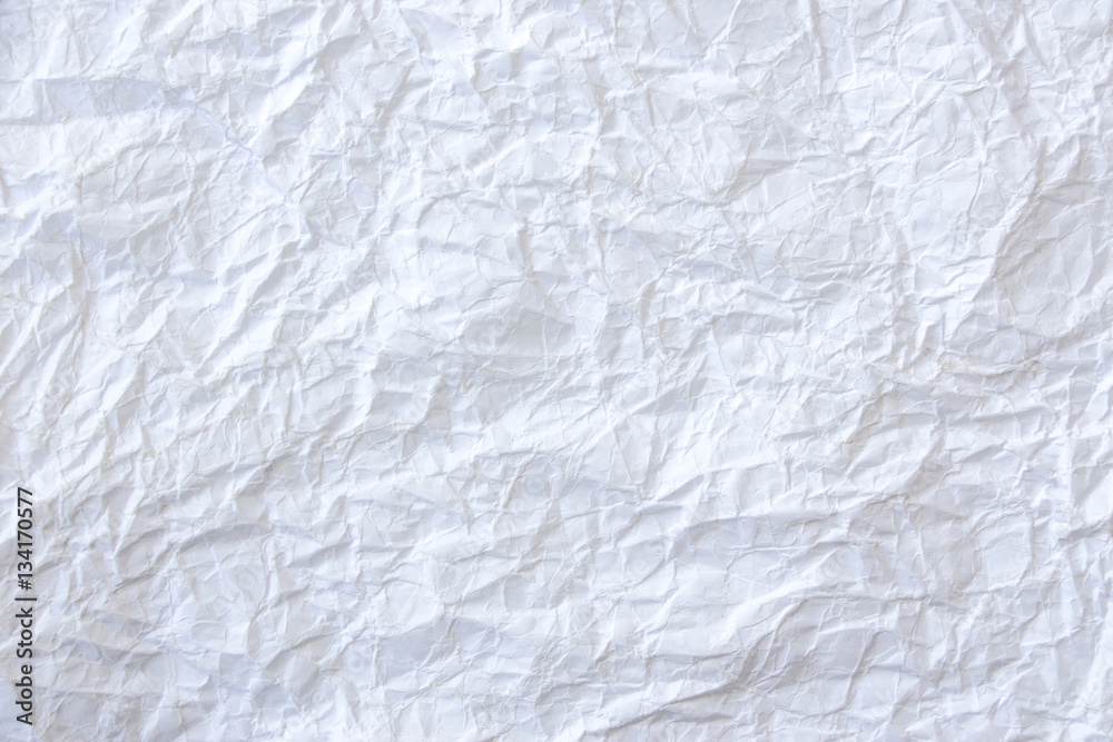 A white, crumpled paper as creative background