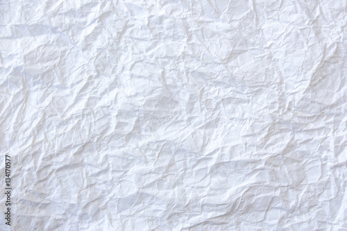A white, crumpled paper as creative background
