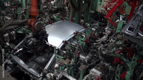 Wallpaper Mural Timelaps Car factory. Robotic arm machine welding and joining pieces. Making car in working lines Torontodigital.ca
