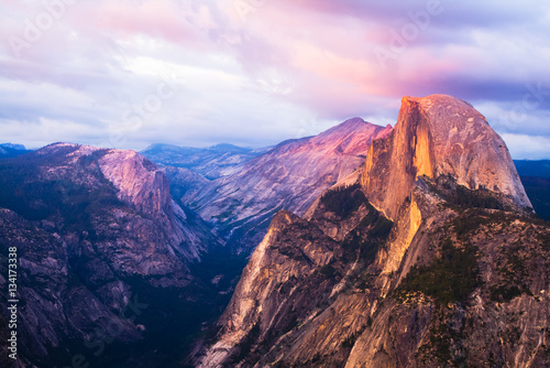Half Dome Rock Yosemite National Park at Sunset.  Pink sky and clouds. photo