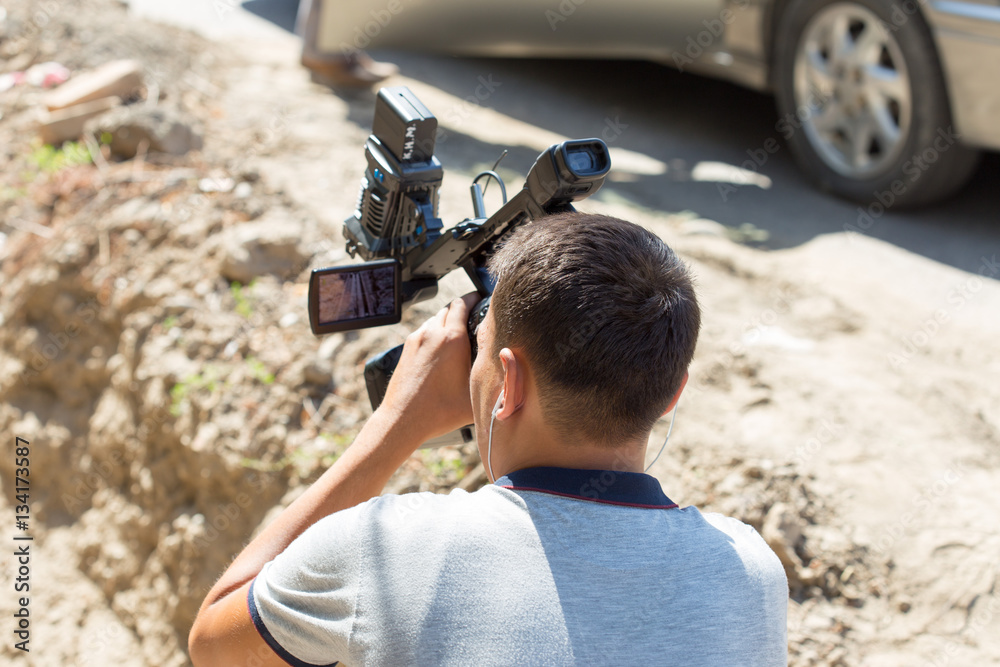 Cameraman working in the street Cameraman working in the street