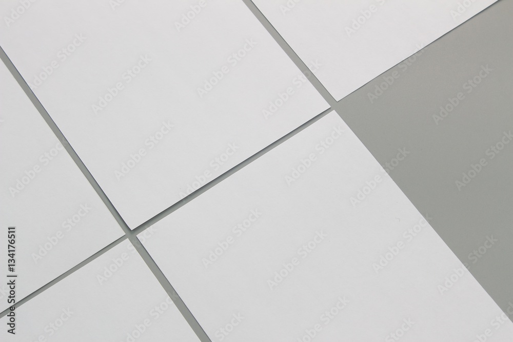 Obraz premium Blank portrait A4. brochure magazine isolated on gray, changeable background / white paper isolated on gray