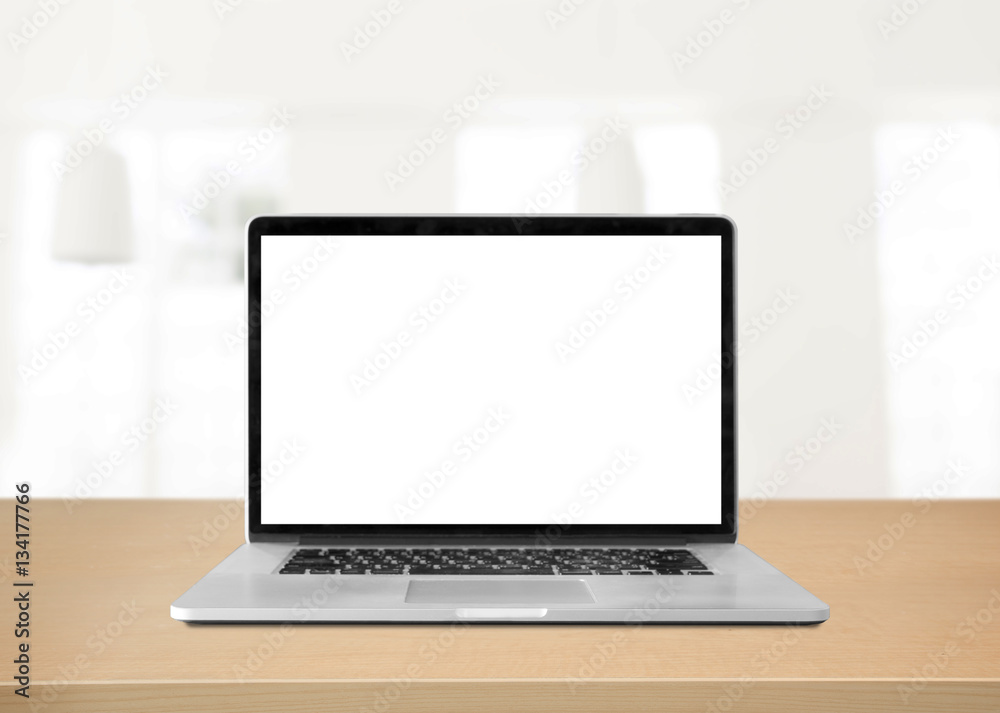 Laptop with blank screen on table. white room background Laptop with blank screen on table. white room background