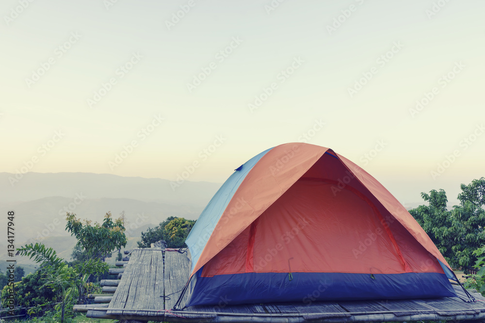 Camping tent on top of mountain field