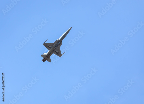 military fighter jet aircraft  flying blue sky background