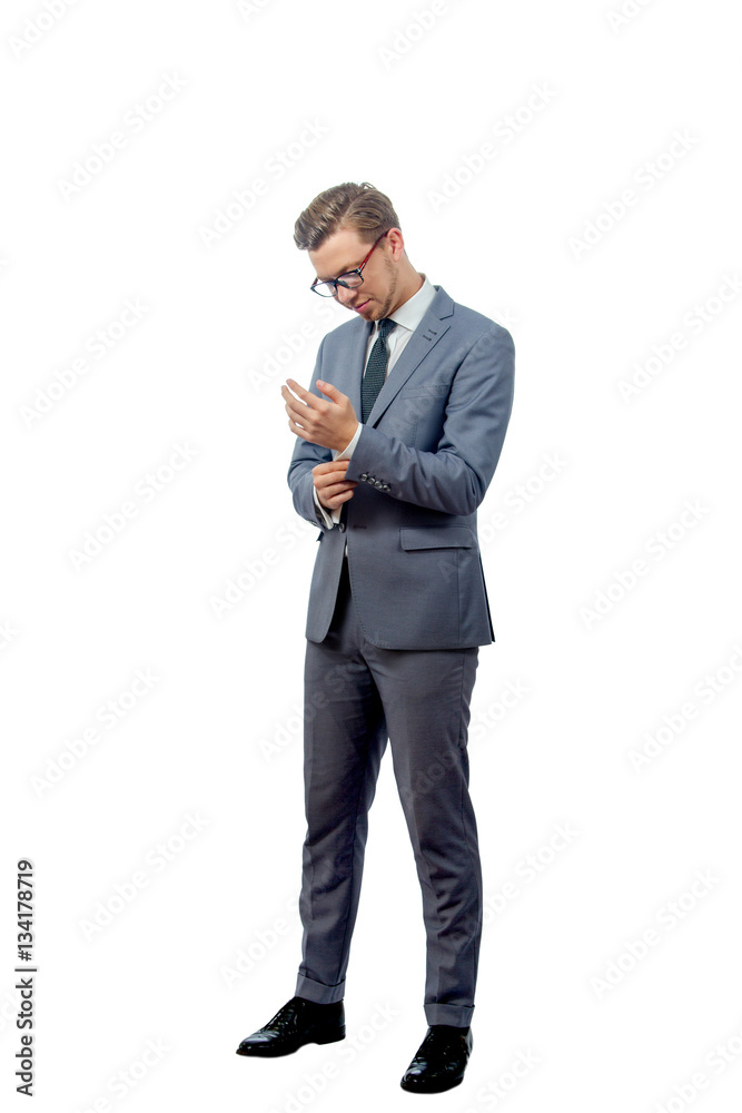 young man in a business suit wearing glasses young man in a business suit wearing glasses
