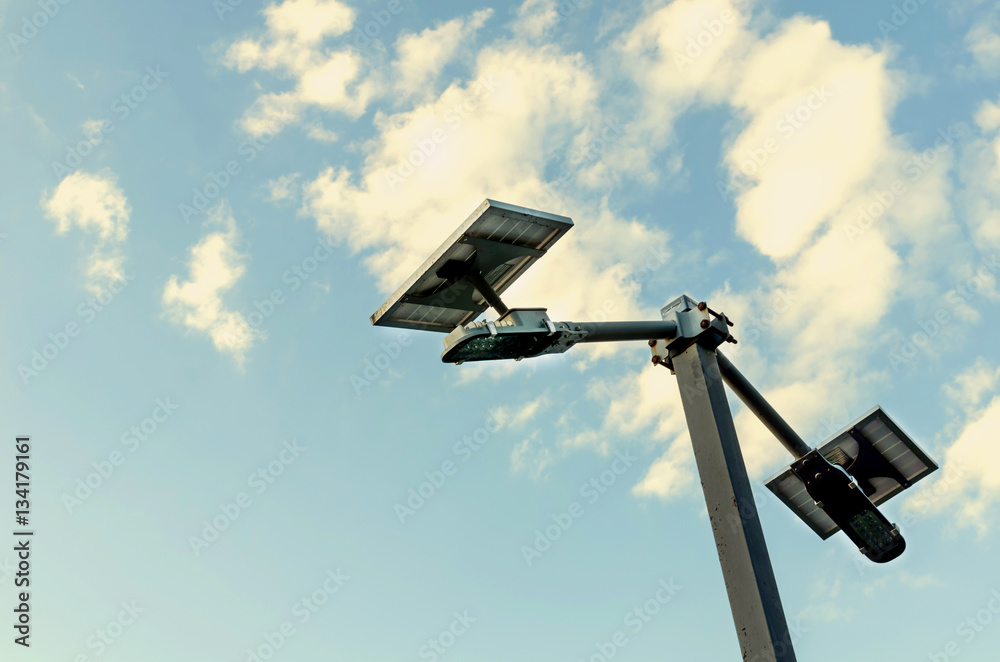 small solar panel against blue skies and cloud small solar panel against blue skies and cloud