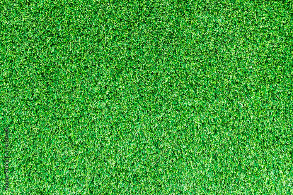 Fototapeta premium Artificial green grass texture for golf course, soccer field or sports background concept design.