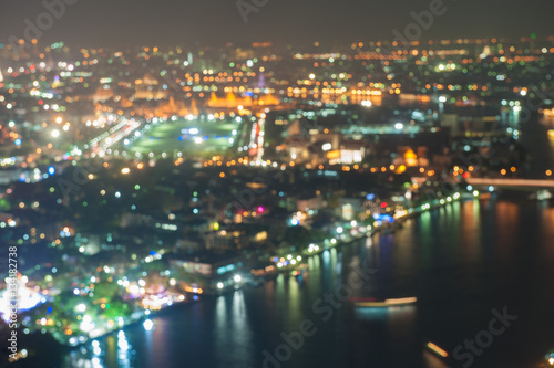 De-focused image Abstract blurred bokeh lights city skyline in Bangkok, The Royal palace and Emerald Buddha temple. Thailand tourist attraction.