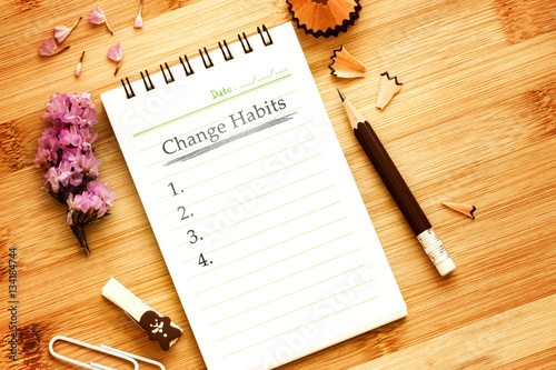 notepad with  pencil  on wooden table for change habits  list co photo
