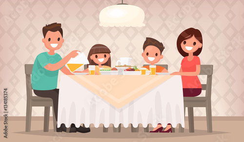 Family meal. Father mother, son and daughter together sit at the
