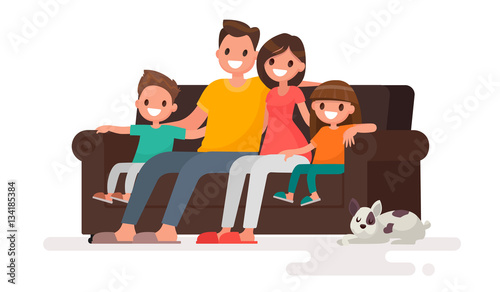 Happy family sitting on the sofa. Father, mother, son and daught