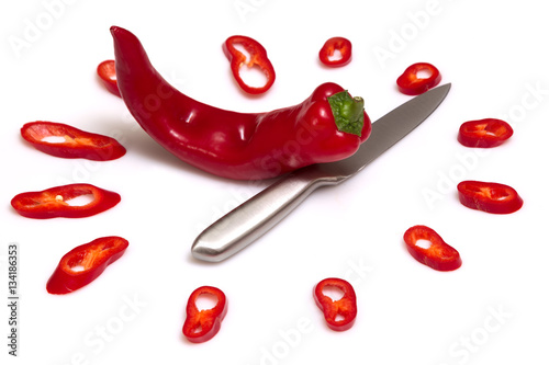 Hot time: Watch of Pepper and knife on white