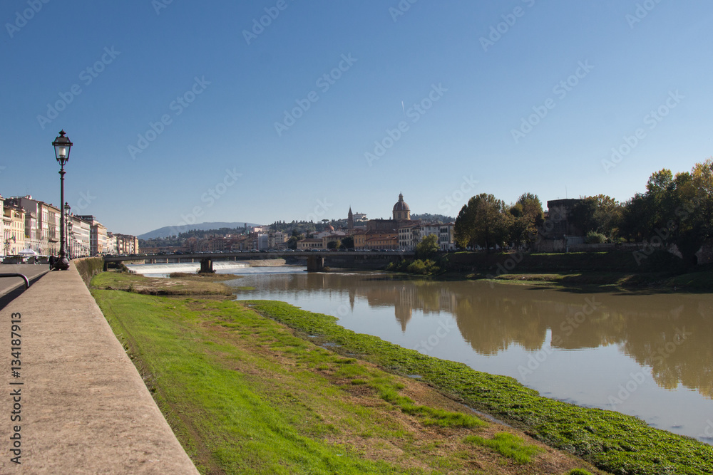 Arno river embankment in a sunny day. Florence. Italy.