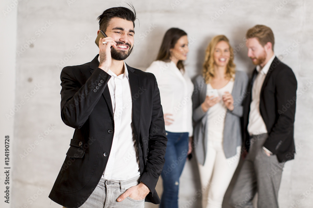 Handsome young businessman with mobile phone Handsome young businessman with mobile phone