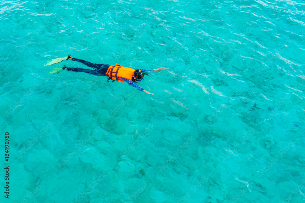 Snorkeling in tropical Maldives island .