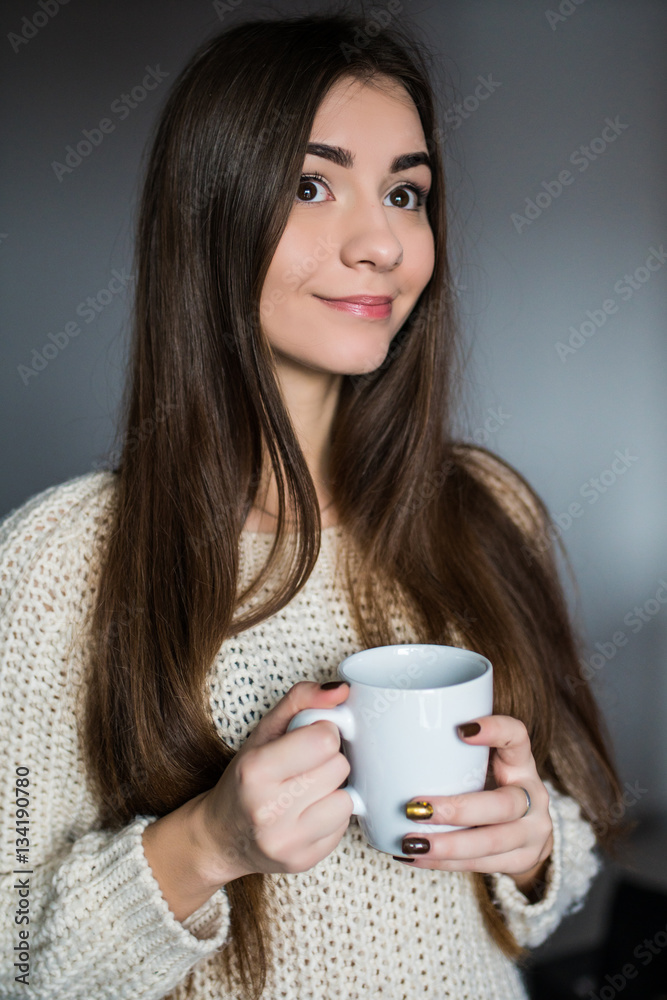Young attractive woman drinking coffee at home Young attractive woman drinking coffee at home