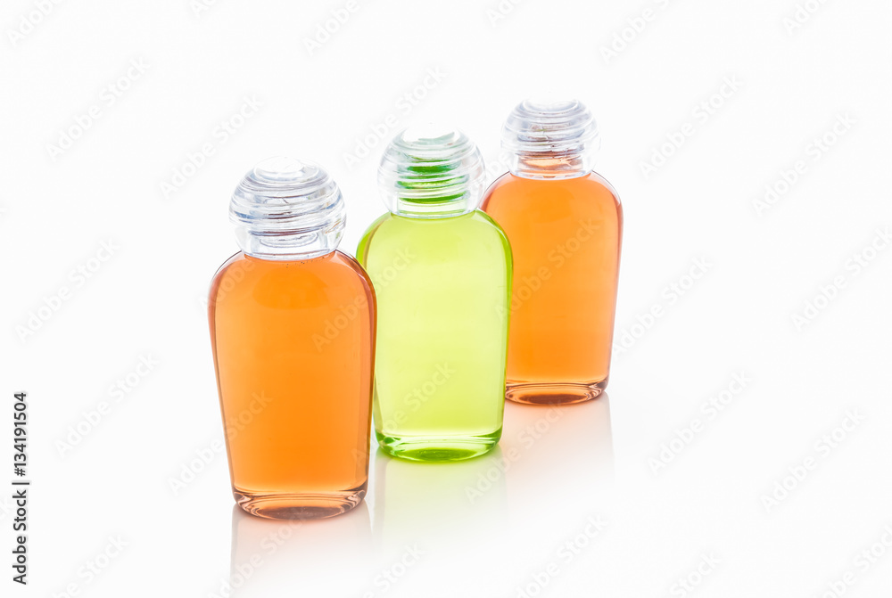 Orange and green bottle of shampoo, gel, soap Orange and green bottle of shampoo, gel, soap