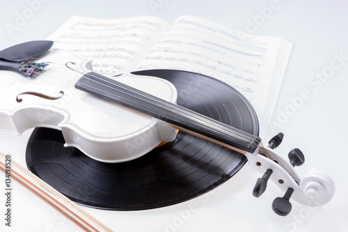 White violin and black record isolated on white background