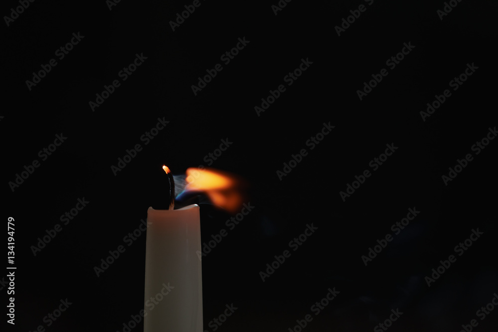 tall candle blown off in the dark environment, shallow focus tall candle blown off in the dark environment, shallow focus