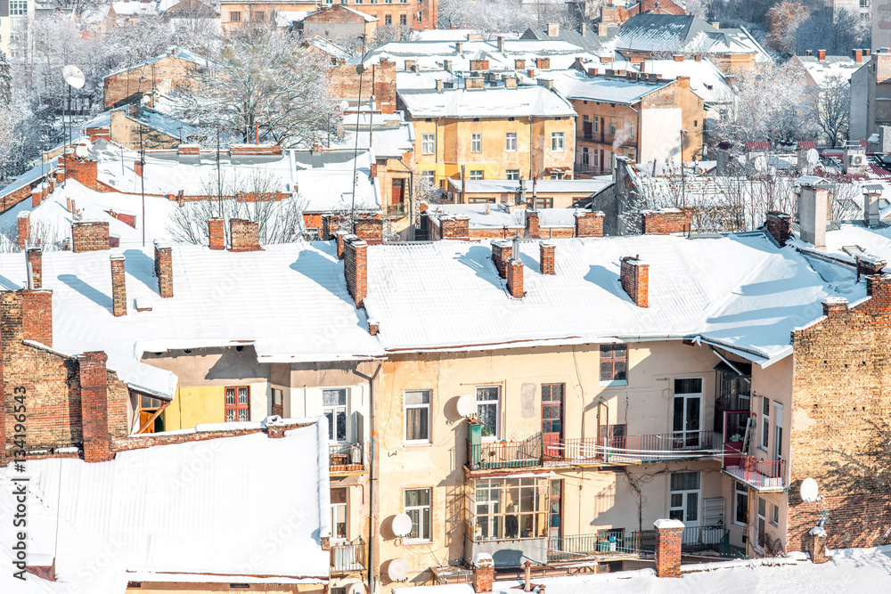 Winter view on the old town with snowbound roofs in Lviv city, Ukraine
