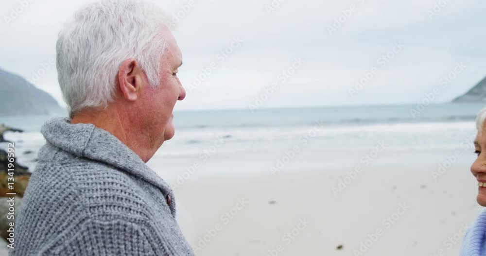 Senior couple embracing each other on the beach Senior couple embracing each other on the beach