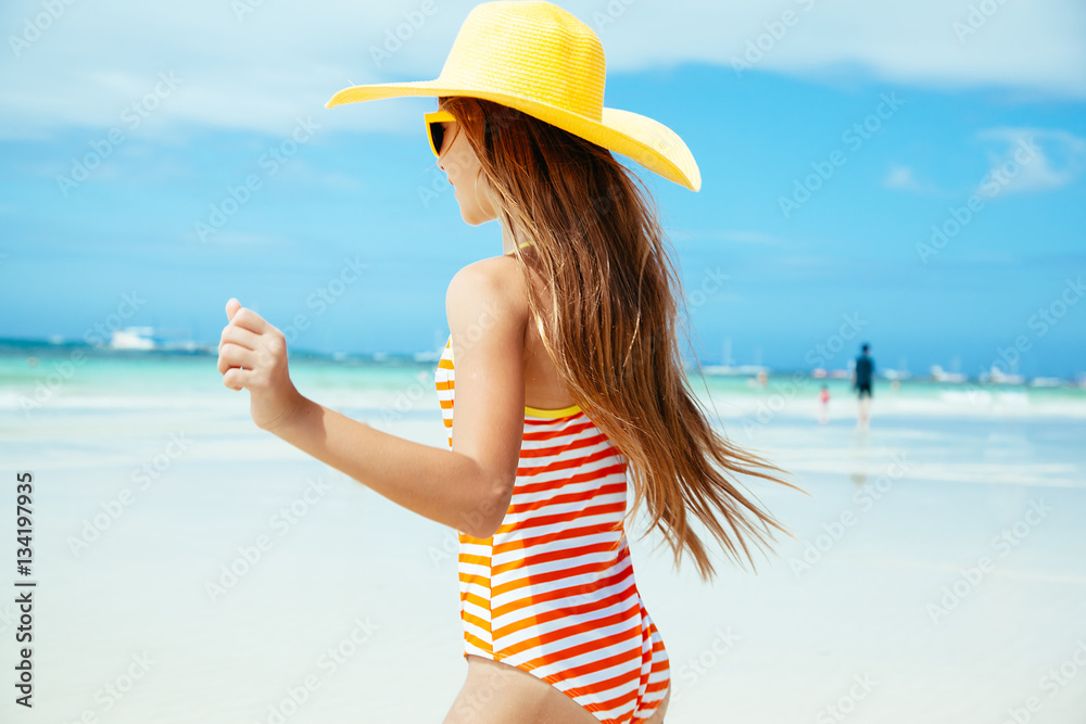 Girl relaxing on the island beach