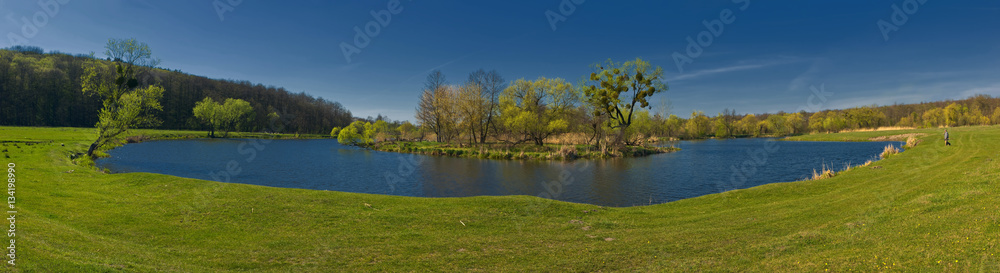 panoramic view of the river makes a turn on the background blue