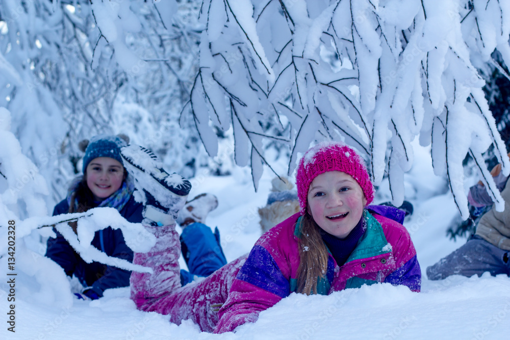 Happy girls having fun with snow